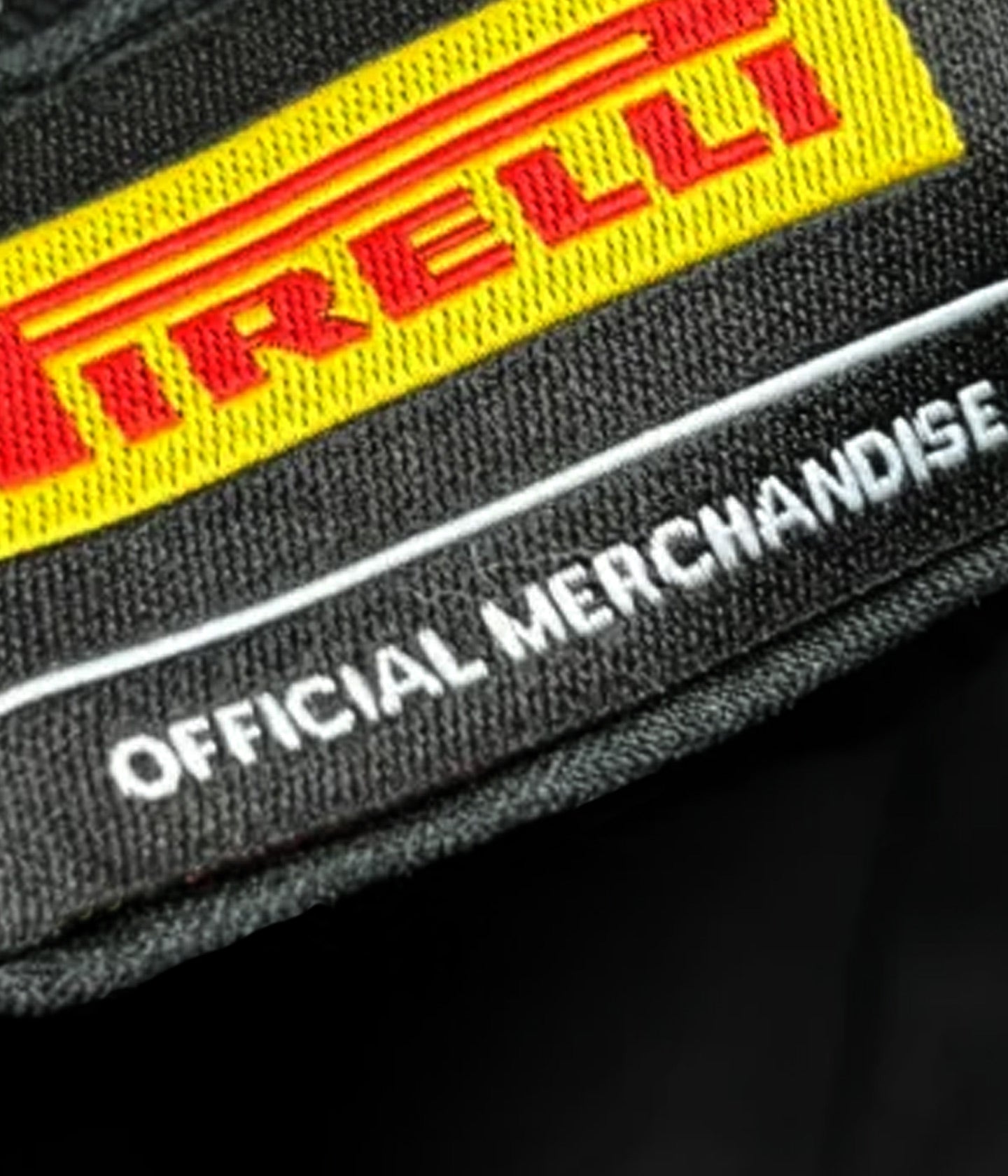 Pirelli logo on a product with 'Official Merchandise' text - F1® Formula 1®