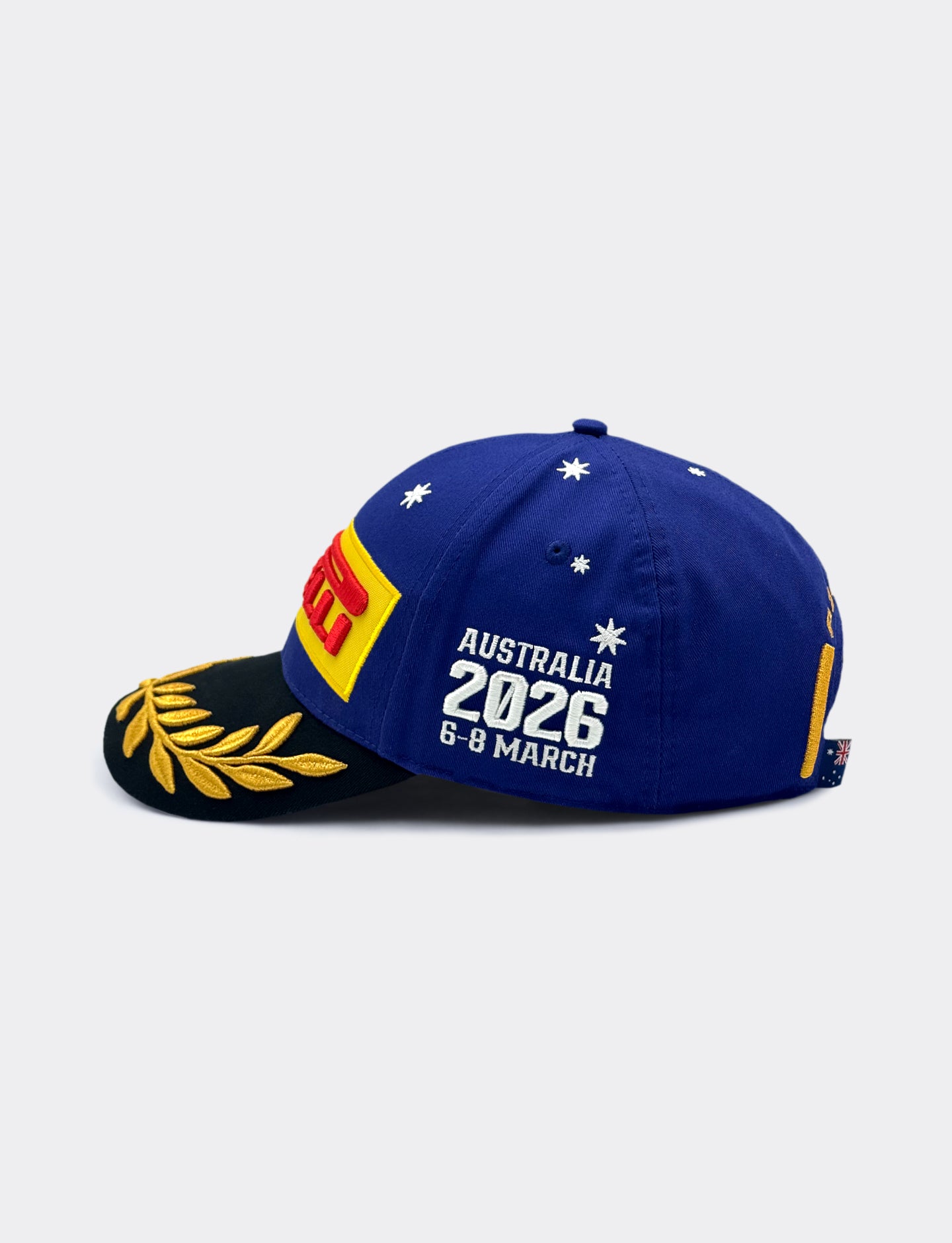 Navy blue Pirelli Podium Cap with black brim and gold embroidery, with Pirelli yellow and red logo, on a white background