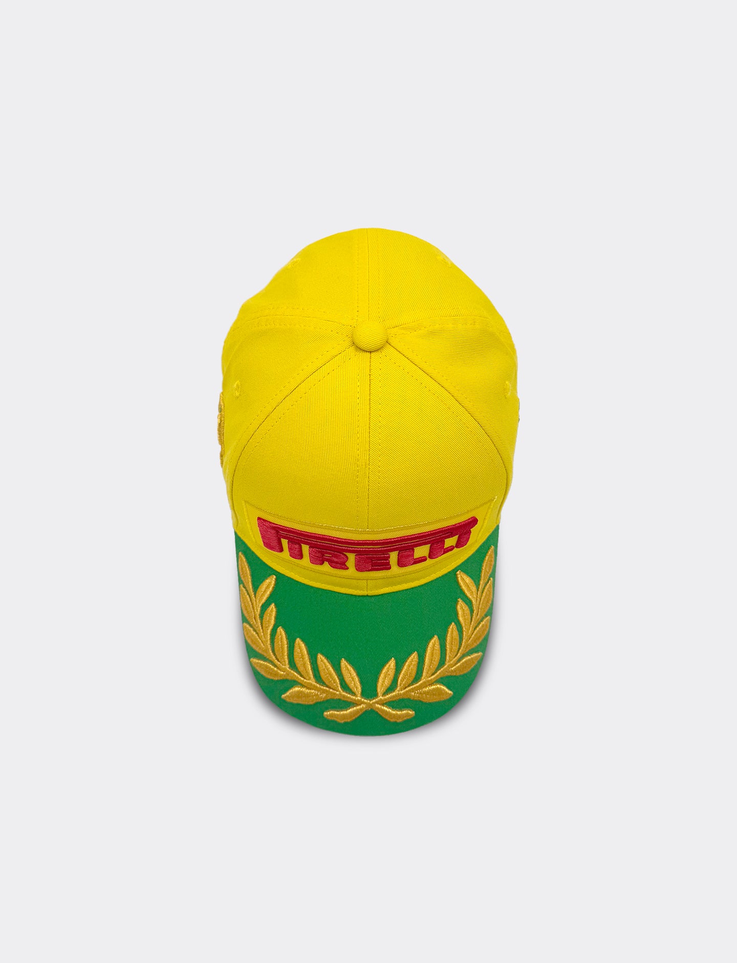 Yellow cap with Pirelli logo on a light gray background