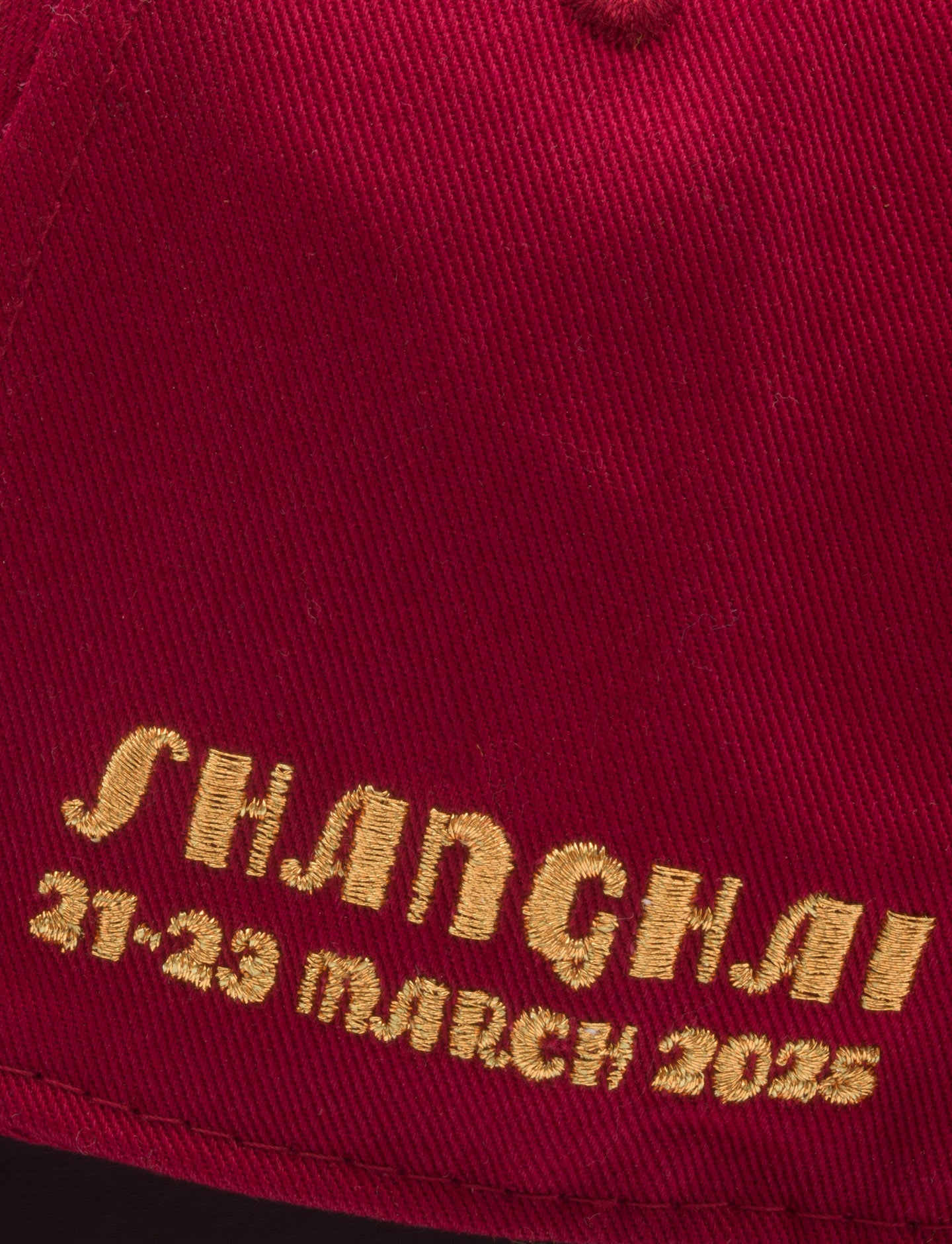 Shanghai and race dates on red cap