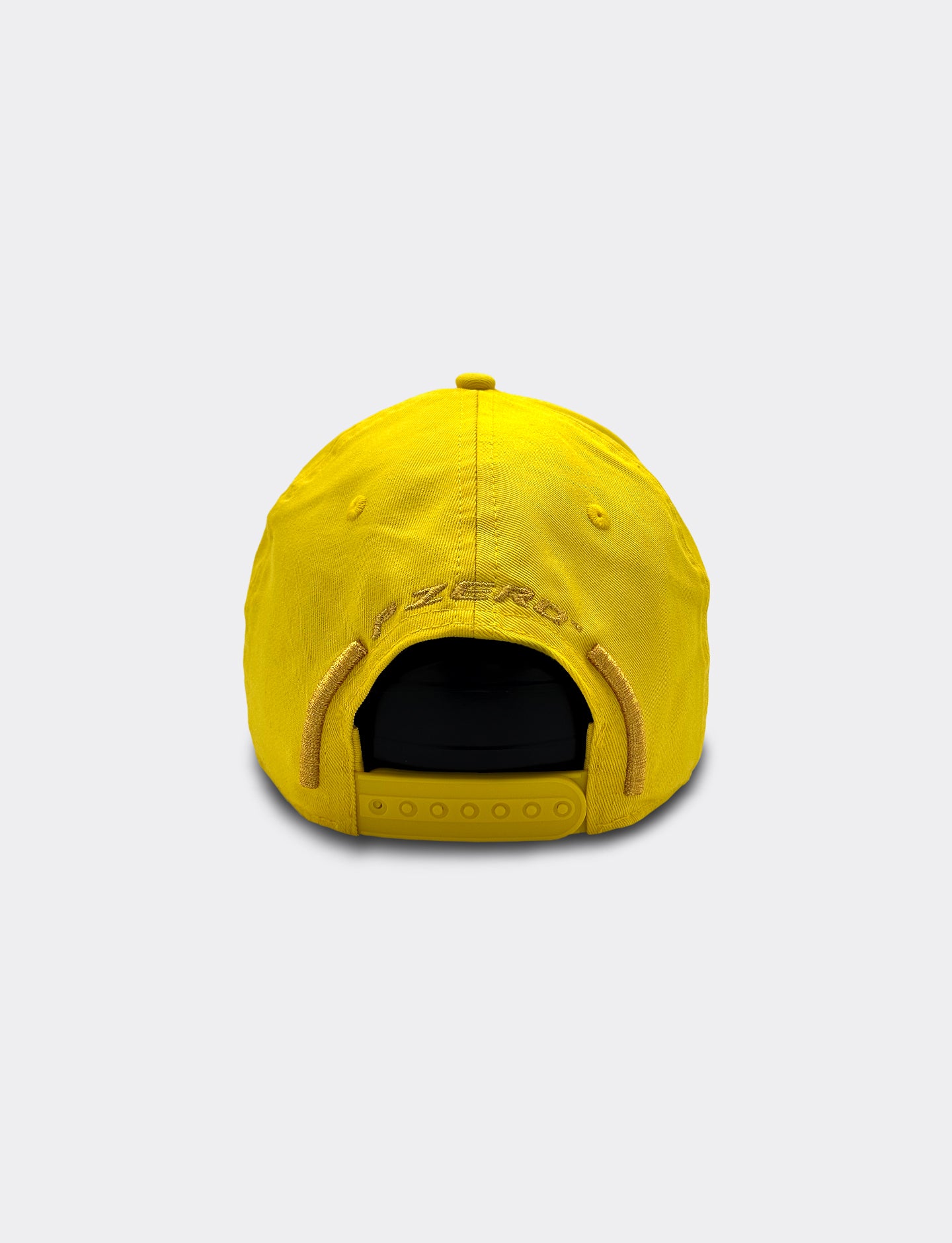 Yellow Pirelli cap on a light gray background