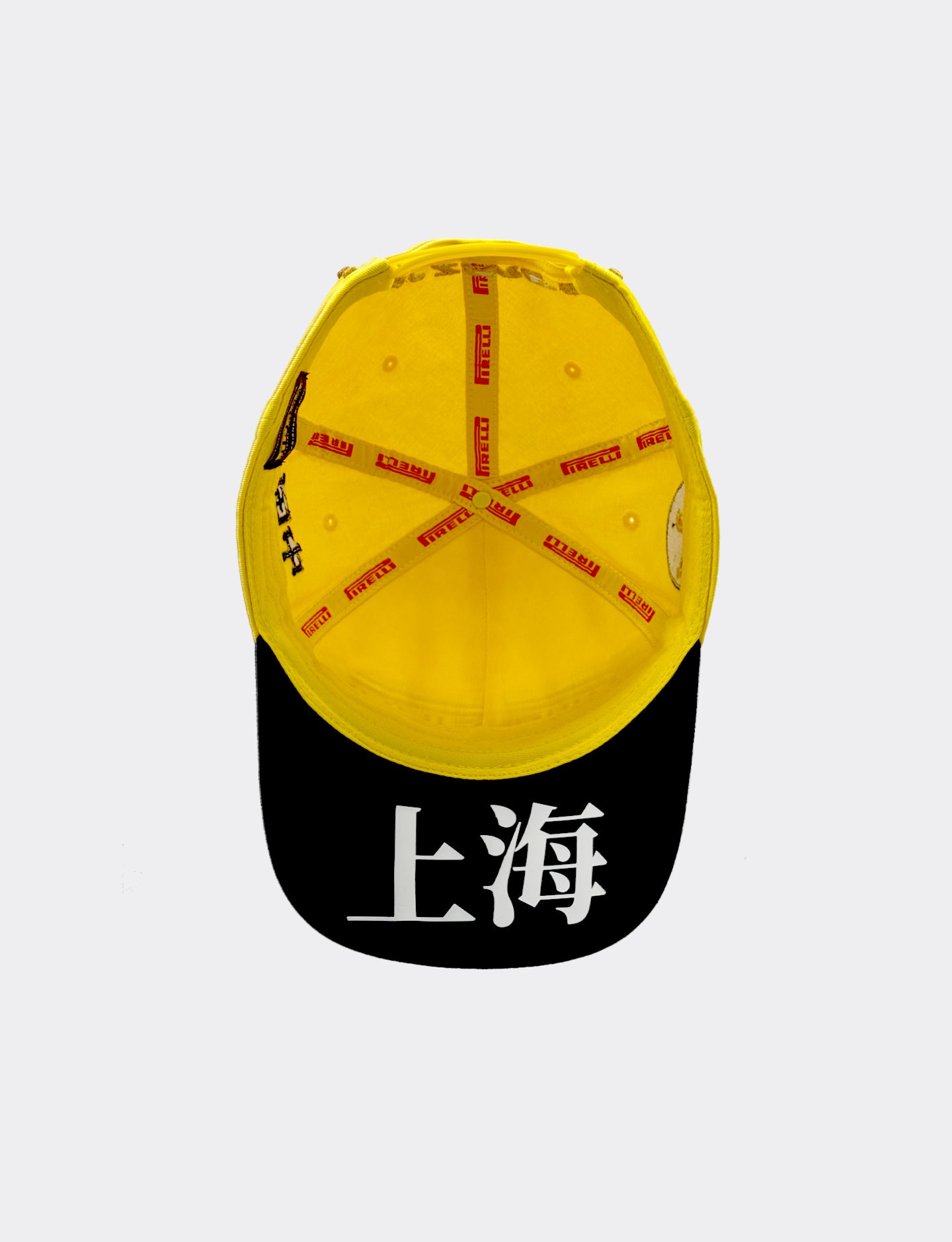 Yellow and black Pirelli cap with Chinese characters on a white background