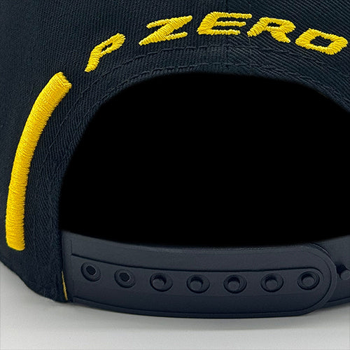 Close-up of a Pirelli Podium Cap 2026 Black with 'P Zero' branding on a gray background