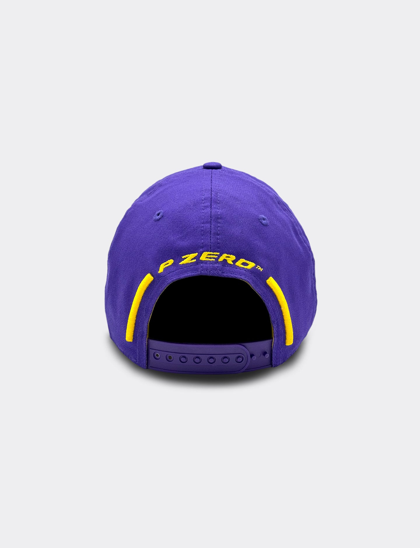 Purple cap with 'P Zero' Pirelli branding on a light gray background