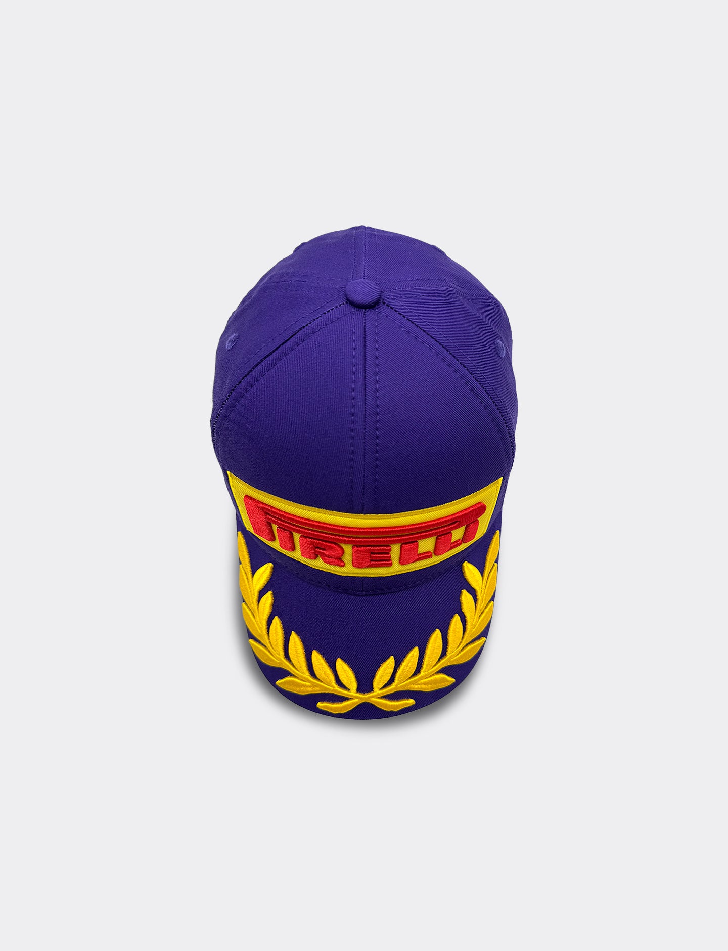 Purple cap with Pirelli logo on a light gray background