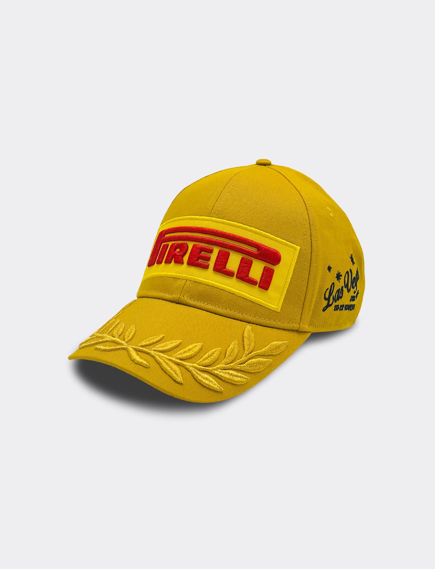 Gold cap with Pirelli logo on a light gray background