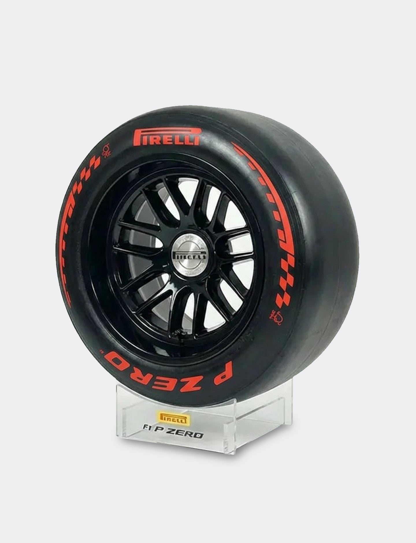 Pirelli racing tire on a stand with a gray background