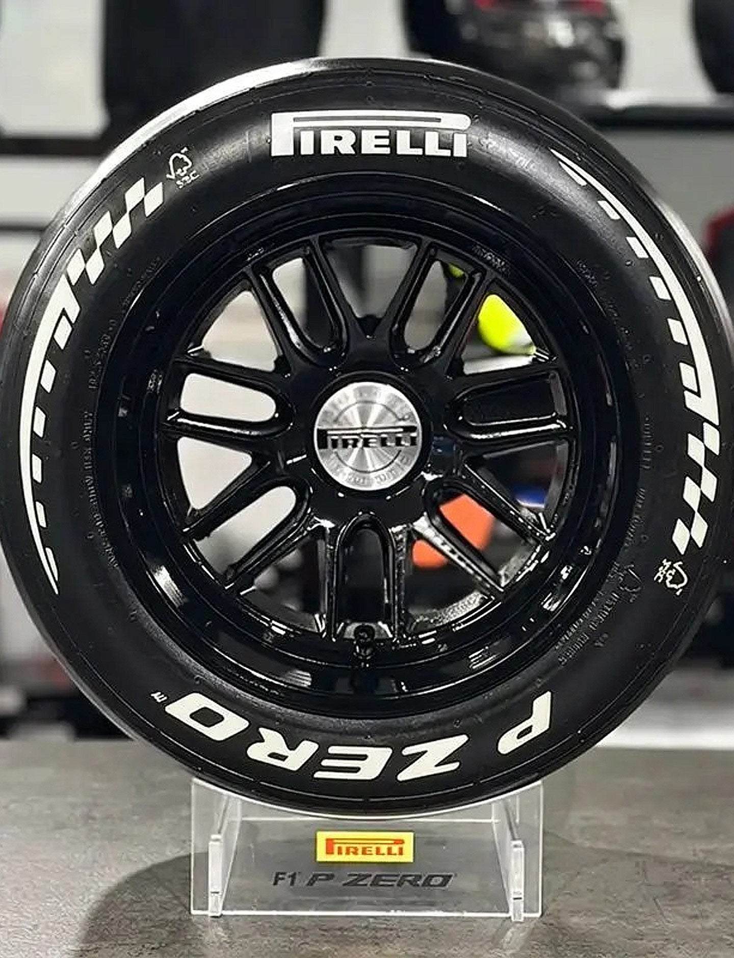 Pirelli tire on a stand with a blurred background
