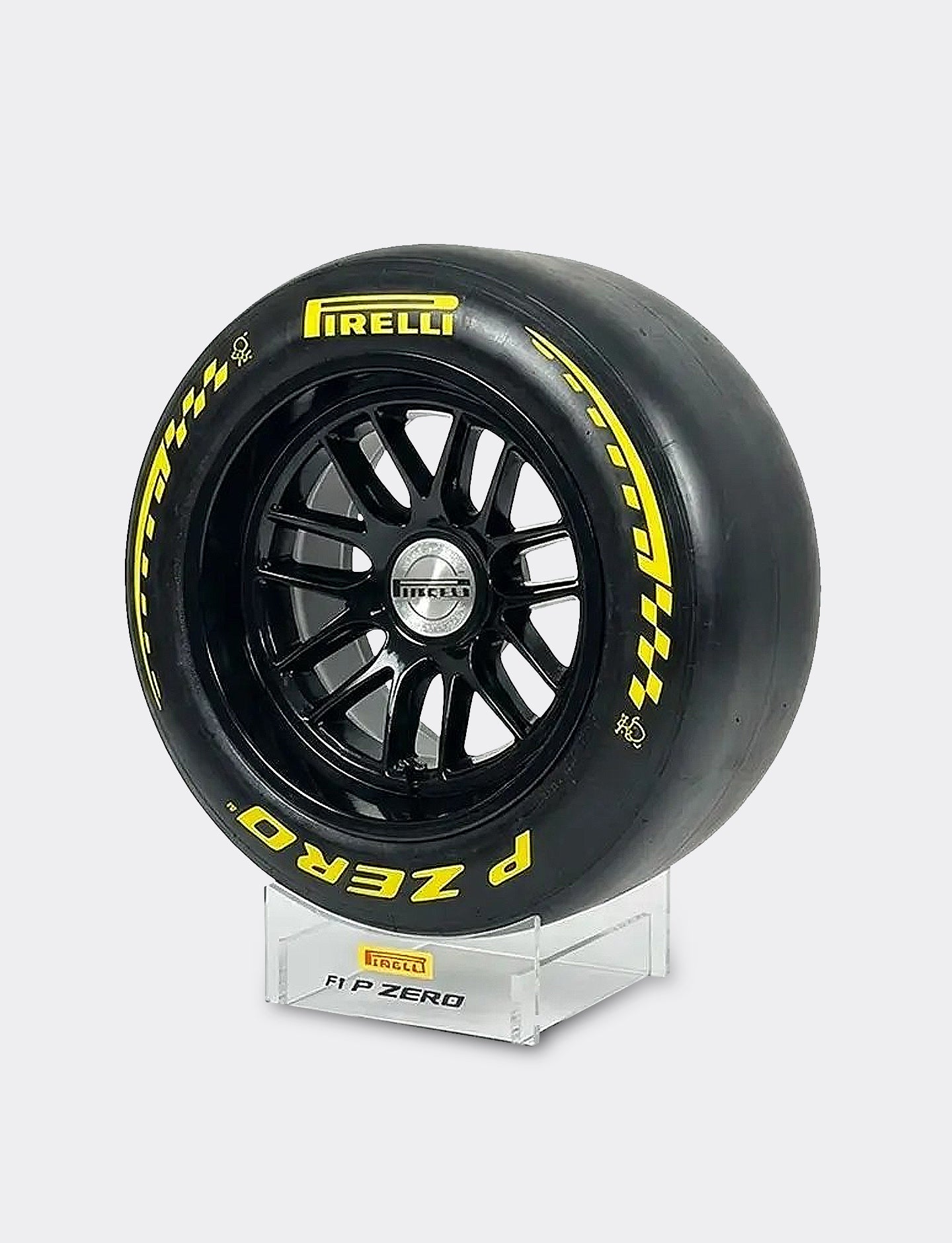 Pirelli tire on a stand with a white background